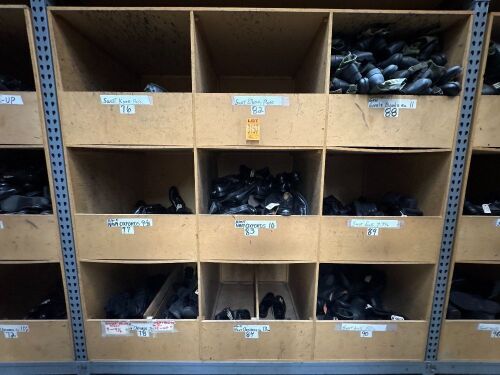 Collection of assorted footwear in 9 cubbies, incl Navy Oxfords, Jungle Boots, SWAT elbow and Knee Pads