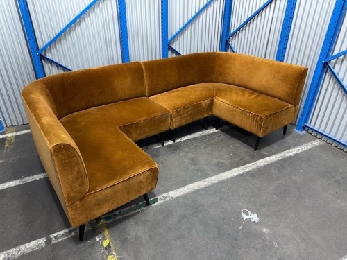 corner sectional sofa upholstered in brown velvet