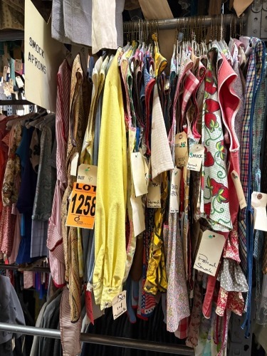 Collection of assorted era smock aprons.