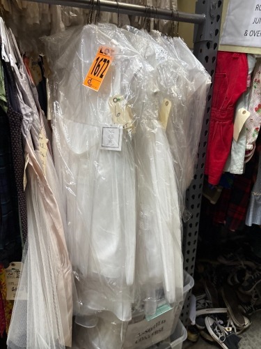 Collection of girl's current white dresses.