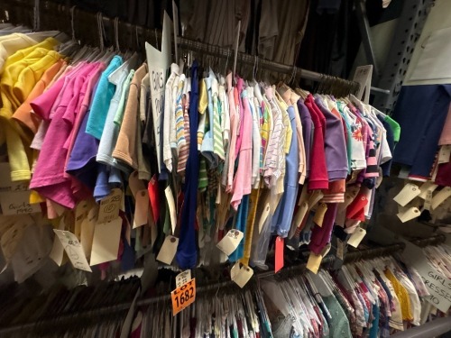 Collection of assorted era girl's polo shirts.