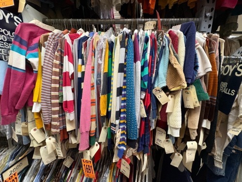 Collection of assorted era boy's long sleeve shirts with collar.