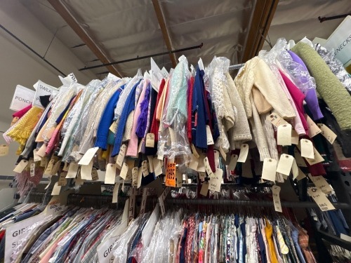 Collection of assorted era girl's cardigans and sweaters.