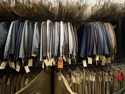 Collection of (50) assorted 1980's 3pc suits. Assorted sizes