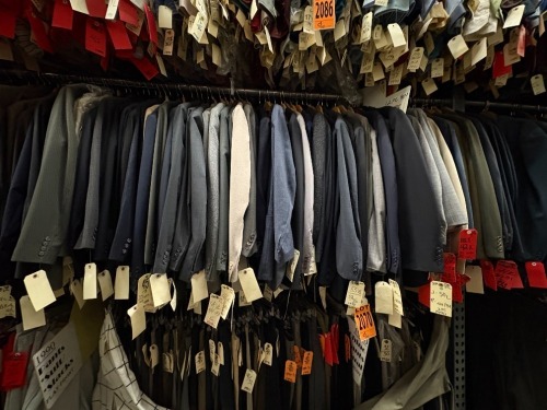 Collection of (50) assorted 1990's 2pc suits. Assorted sizes. Includes (6) sets of doubles