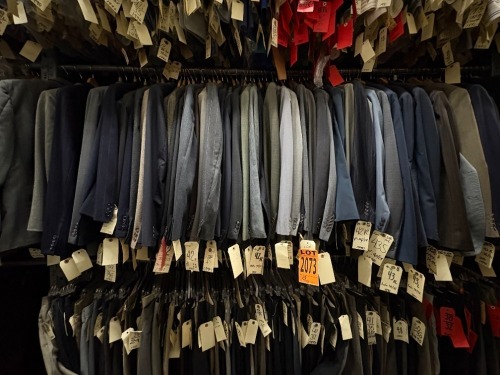 Collection of (50) assorted 1990's suit jackets. Assorted sizes