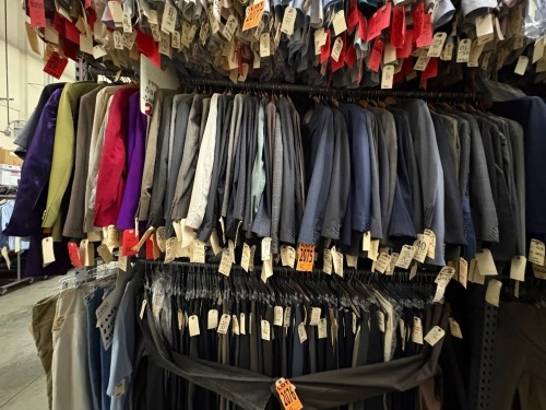Collection of (70) assorted 1990's 2pc suits. Assorted sizes