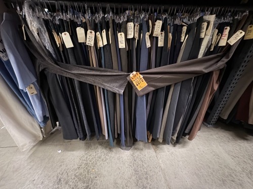 Collection of (100) assorted 1990's men dress pants. Assorted sizes