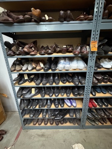 Collection of assorted Men's civilian footwear, on 32 sections of shelving