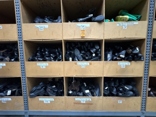 Collection of assorted footwear in 9 cubbies, incl. black Sorels, Black laces up dress shoes, work shoes