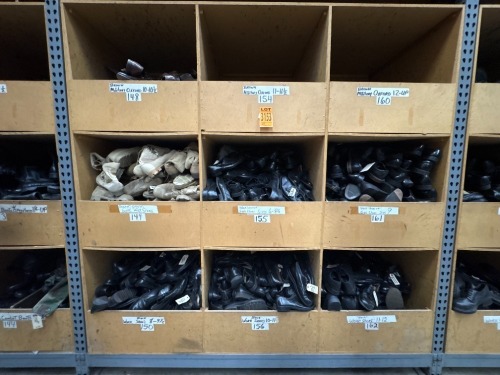 Collection of assorted footwear in 9 cubbies, incl. military oxford, work shoes, various sizes